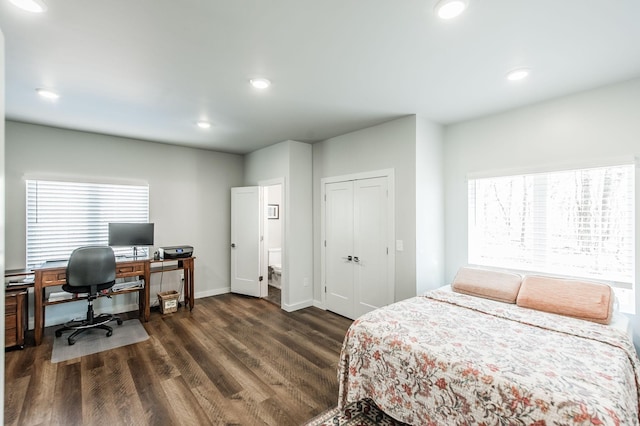 bedroom featuring a closet and dark hardwood / wood-style floors