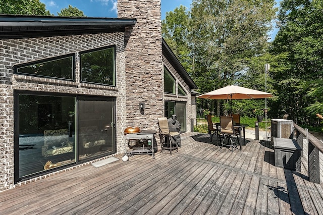 wooden terrace with central AC and grilling area