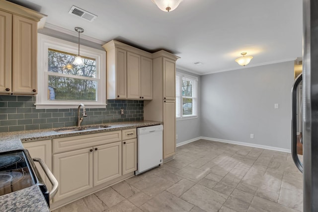 kitchen featuring pendant lighting, crown molding, sink, appliances with stainless steel finishes, and tasteful backsplash