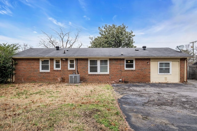 rear view of house featuring a patio and central AC unit