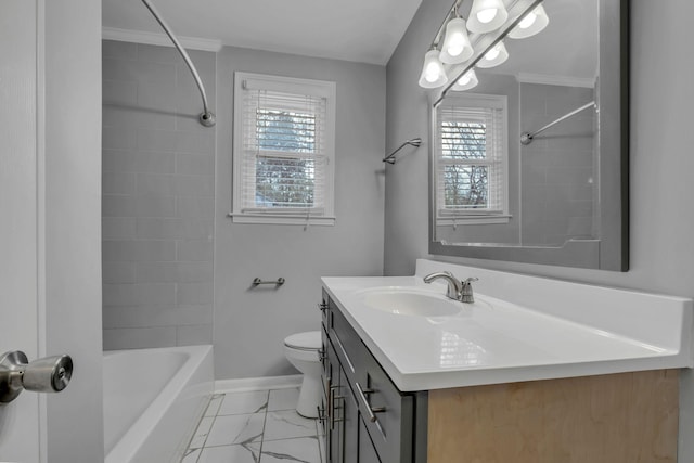 full bathroom with tiled shower / bath, crown molding, vanity, and toilet