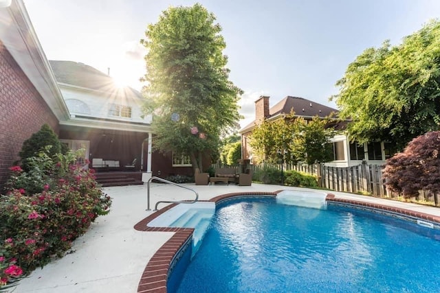 view of pool featuring a patio