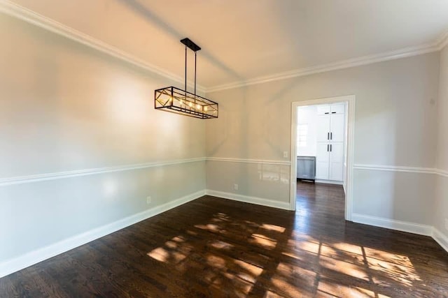 unfurnished dining area with dark hardwood / wood-style floors and ornamental molding