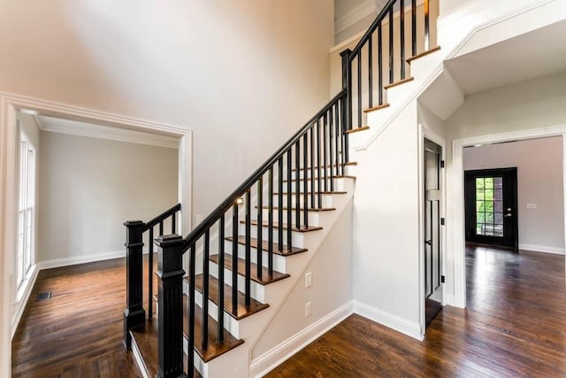 stairway with hardwood / wood-style flooring