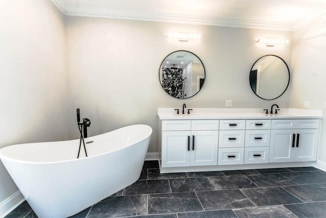 bathroom featuring vanity, crown molding, and a tub