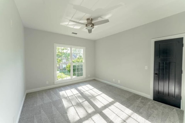 unfurnished room with ceiling fan and light carpet