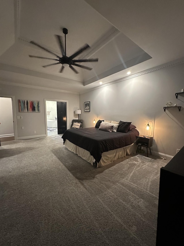 carpeted bedroom featuring ceiling fan and a raised ceiling