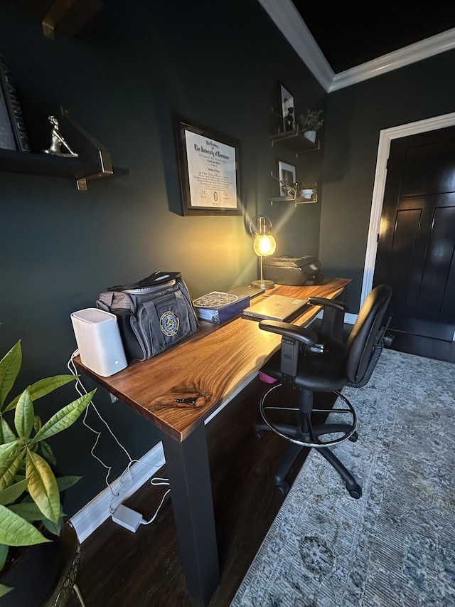 home office featuring dark hardwood / wood-style flooring and crown molding