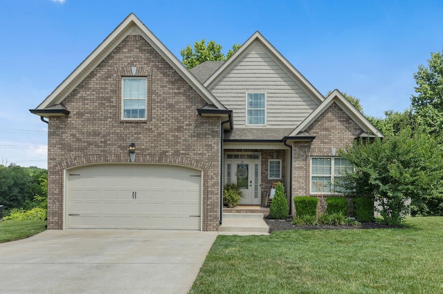 view of front of house featuring a front yard and a garage