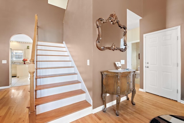 staircase featuring wood-type flooring