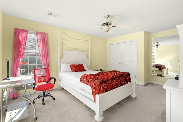 carpeted bedroom with ceiling fan and a closet