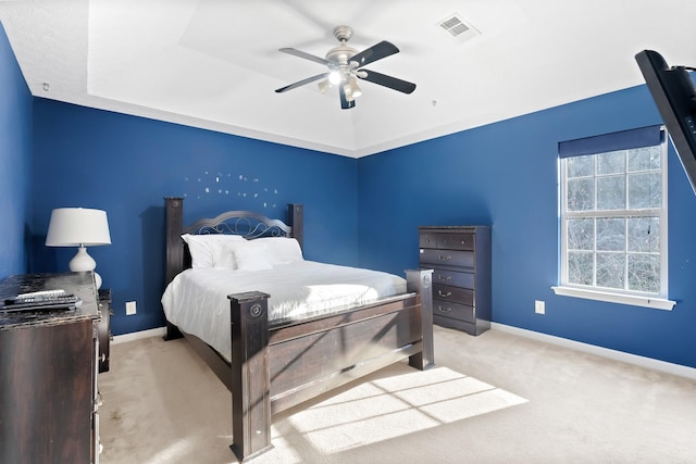 bedroom featuring ceiling fan and light carpet