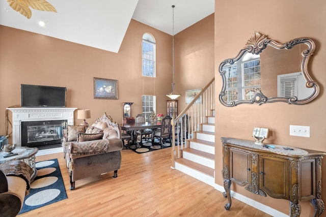 entryway with a high ceiling and light hardwood / wood-style flooring