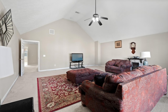 carpeted living room with ceiling fan and lofted ceiling