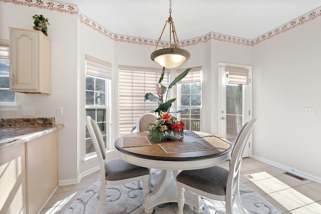 dining space with light tile patterned flooring