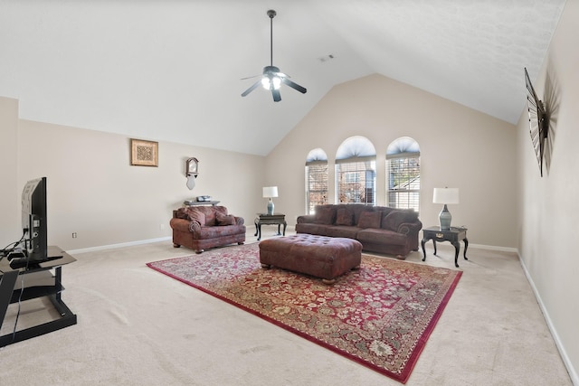 living room with light carpet, ceiling fan, and high vaulted ceiling