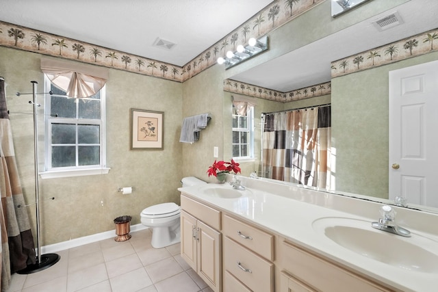 bathroom with tile patterned floors, vanity, a shower with shower curtain, and toilet