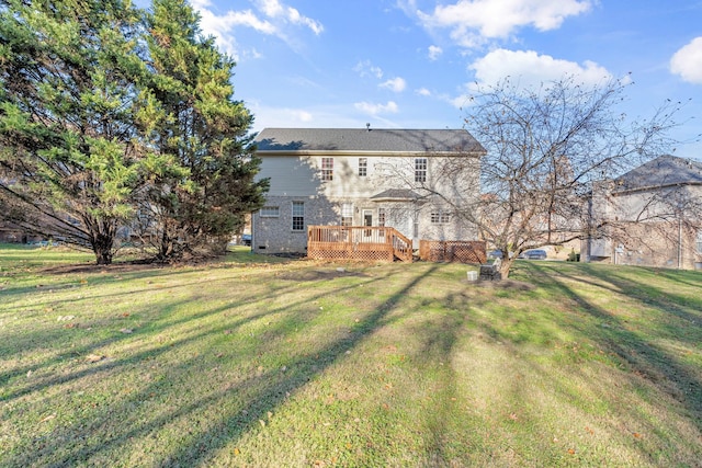 view of yard with a wooden deck