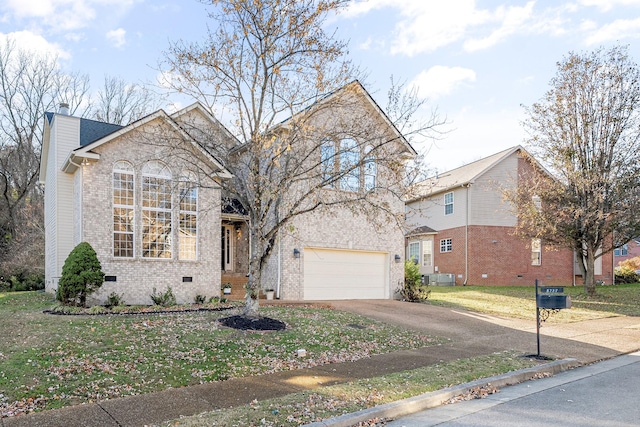 front of property with a front lawn and a garage