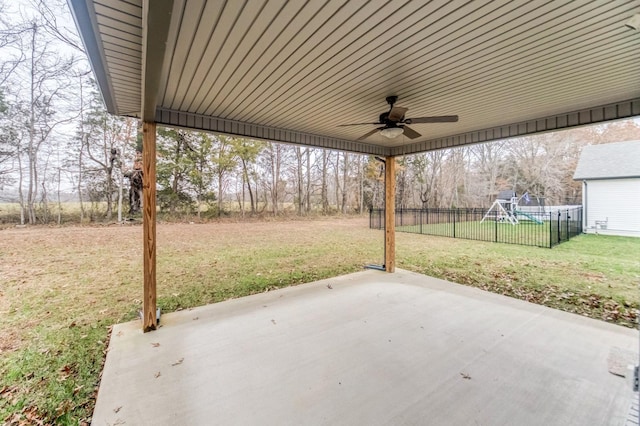 view of patio / terrace with a playground, ceiling fan, and fence