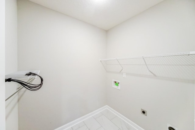 laundry room featuring laundry area, baseboards, marble finish floor, washer hookup, and electric dryer hookup