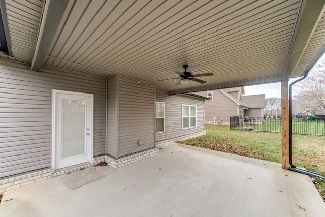 view of patio featuring fence and a ceiling fan