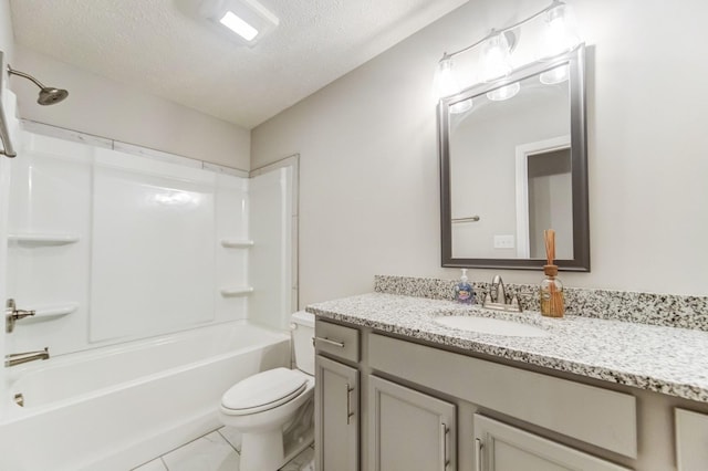 bathroom with toilet, marble finish floor, bathtub / shower combination, a textured ceiling, and vanity