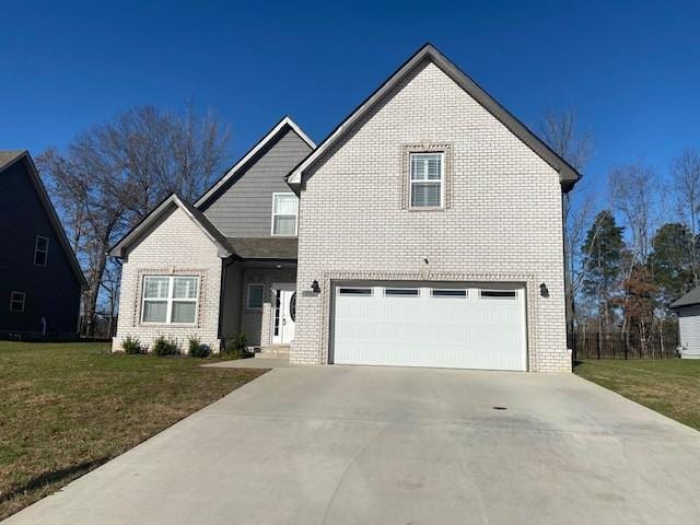 view of front property with a garage and a front lawn