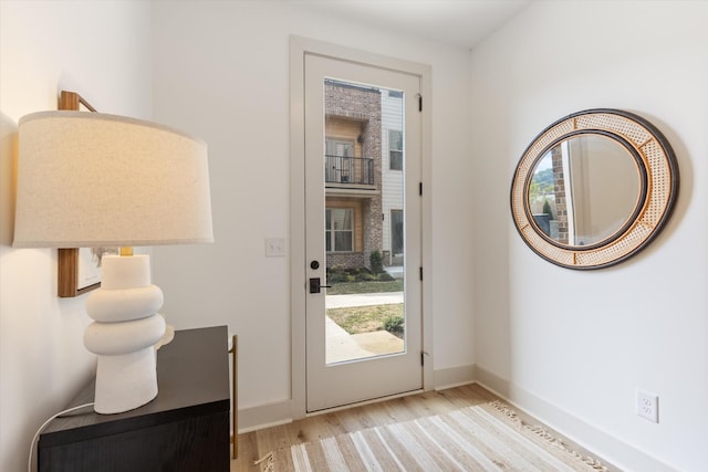 entryway featuring light hardwood / wood-style floors and a wealth of natural light