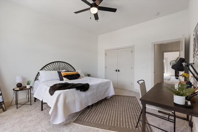 bedroom featuring ceiling fan and light colored carpet