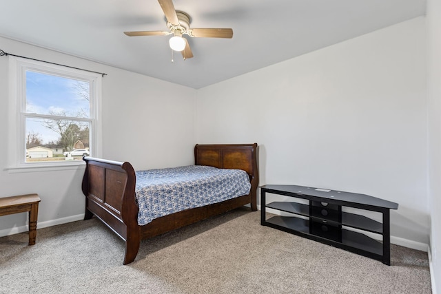 bedroom featuring light carpet and ceiling fan