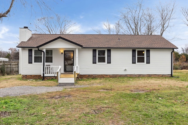 ranch-style house with a front yard and covered porch