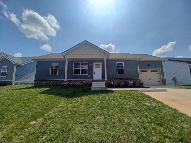 view of front facade with a garage and a front lawn