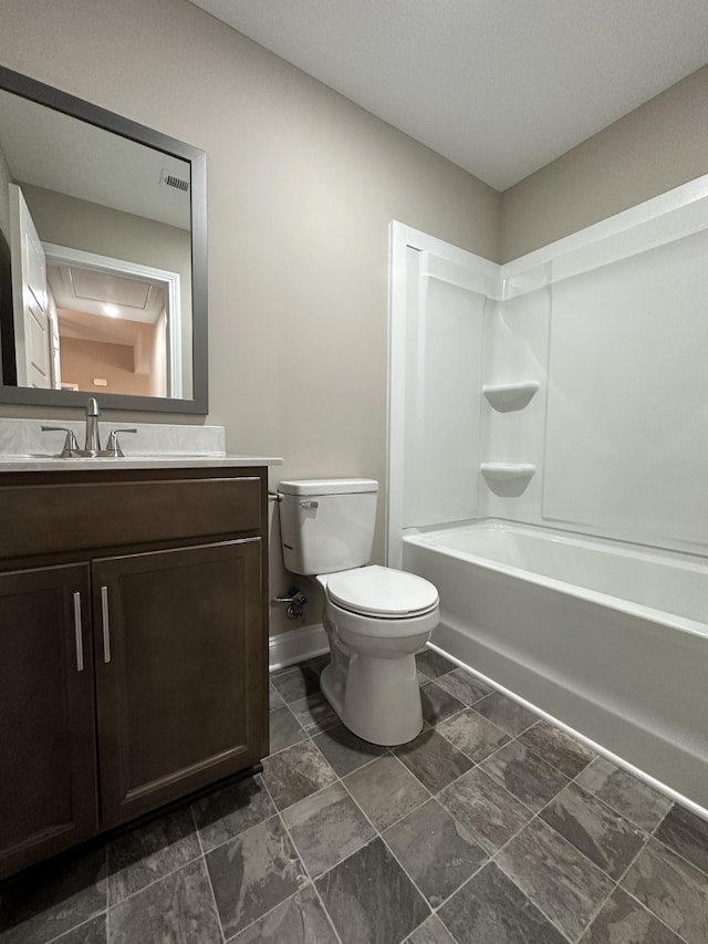 full bathroom with vanity, toilet, and  shower combination