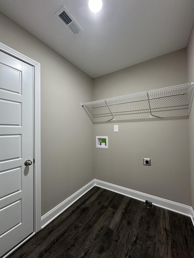 laundry area featuring dark hardwood / wood-style floors, hookup for a washing machine, and electric dryer hookup