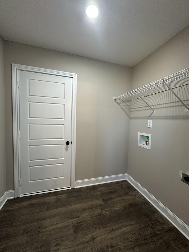 washroom with hookup for a washing machine, laundry area, baseboards, and dark wood-style flooring