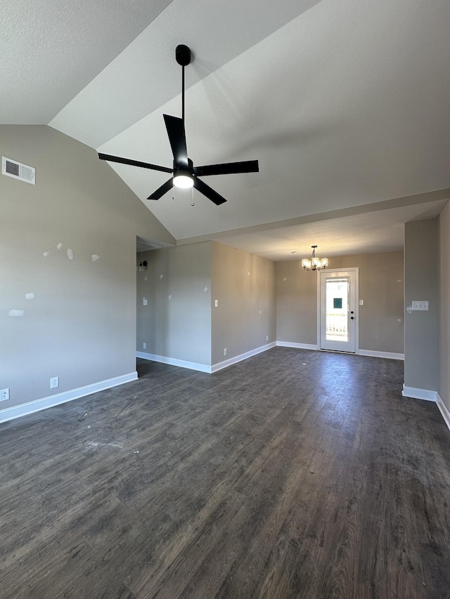 unfurnished living room with dark wood-style floors, visible vents, vaulted ceiling, baseboards, and ceiling fan with notable chandelier