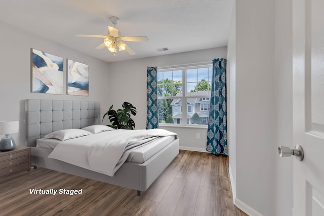 bedroom featuring ceiling fan and wood-type flooring