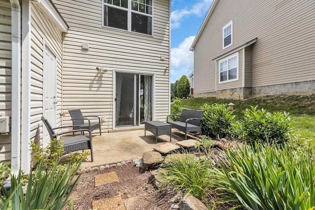 back of property with a patio