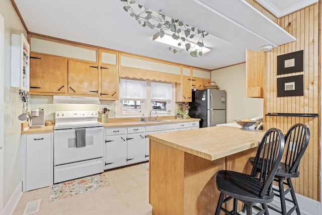 kitchen with sink, stainless steel fridge, ornamental molding, range hood, and white electric range oven