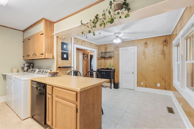 kitchen with ceiling fan, light brown cabinets, black dishwasher, crown molding, and washer and clothes dryer