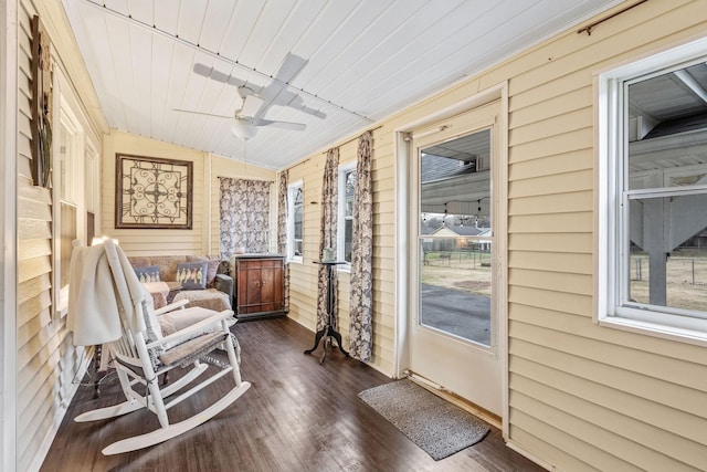 sunroom with ceiling fan, lofted ceiling, and wood ceiling