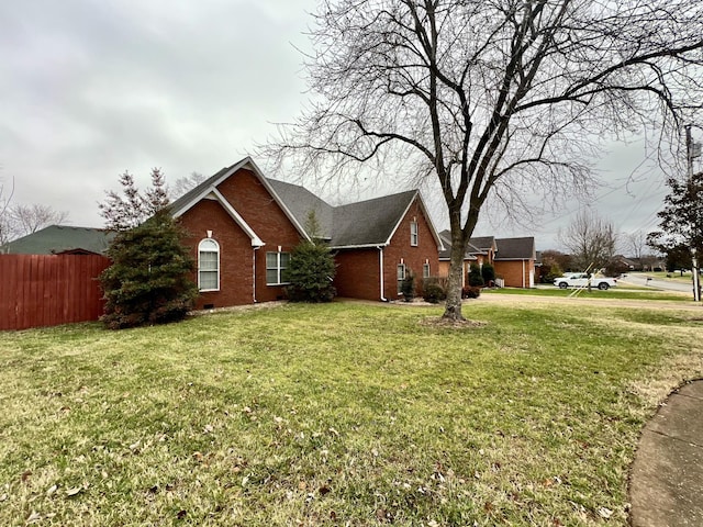 view of property exterior with a yard