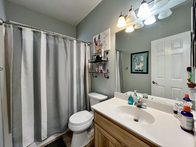 bathroom featuring tile patterned flooring, vanity, toilet, and a shower with shower curtain