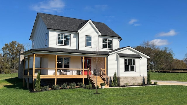 view of front facade featuring a front lawn and covered porch