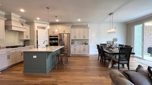 1510 Frye Rd, Columbia, TN 38401 - kitchen with appliances with stainless steel finishes, healthy amount of natural light, premium range hood, backsplash, and ornamental molding