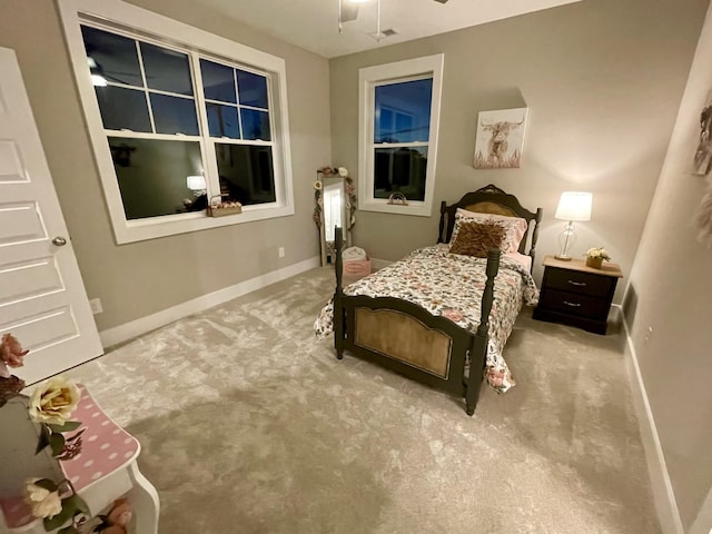 carpeted bedroom with ceiling fan