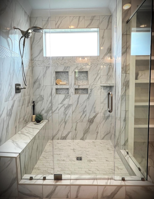 bathroom featuring an enclosed shower