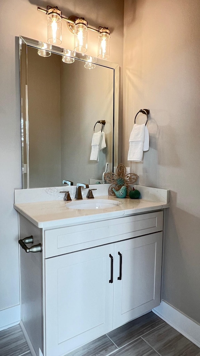 bathroom featuring wood-type flooring and vanity