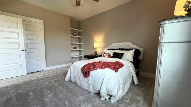 carpeted bedroom featuring ceiling fan, white fridge, and a closet